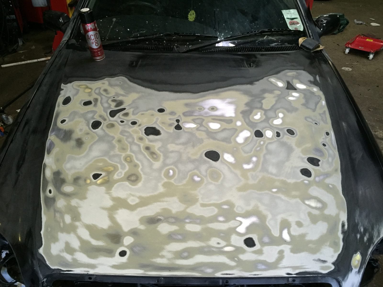 The bonnet covered in body filler