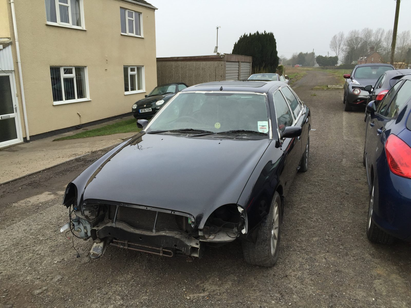 The black Granada Scorpio outdoors with the front bumper off